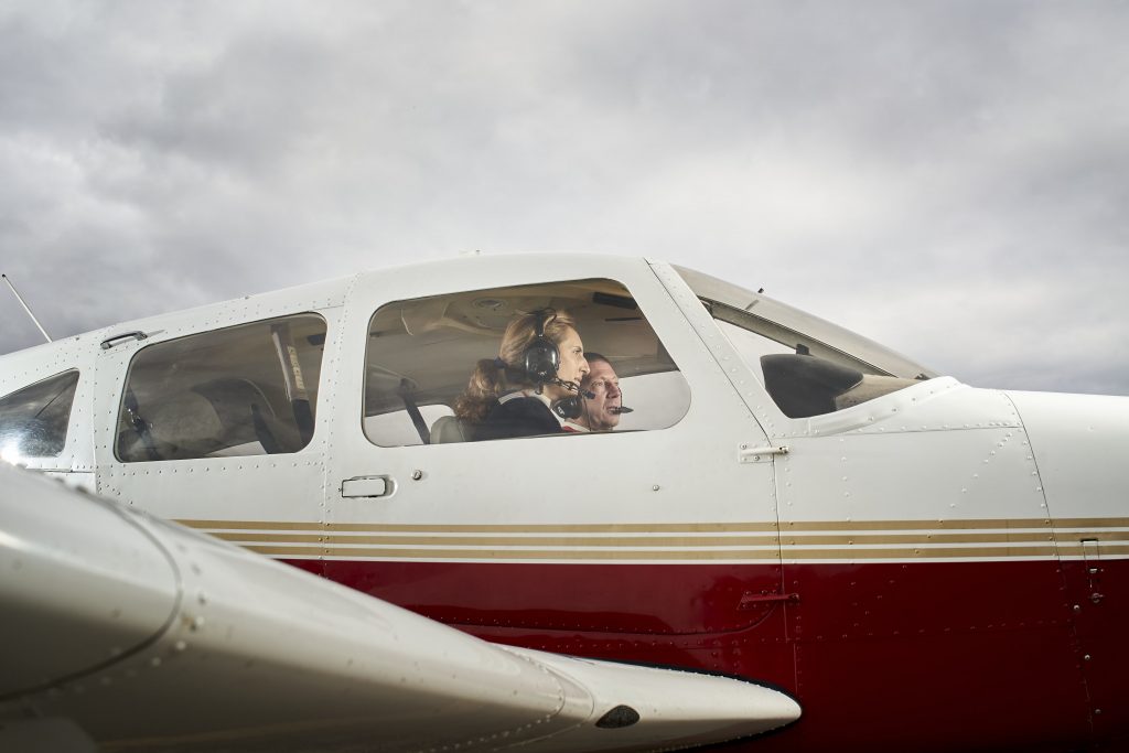 pilot instructor teaching student about aircraft