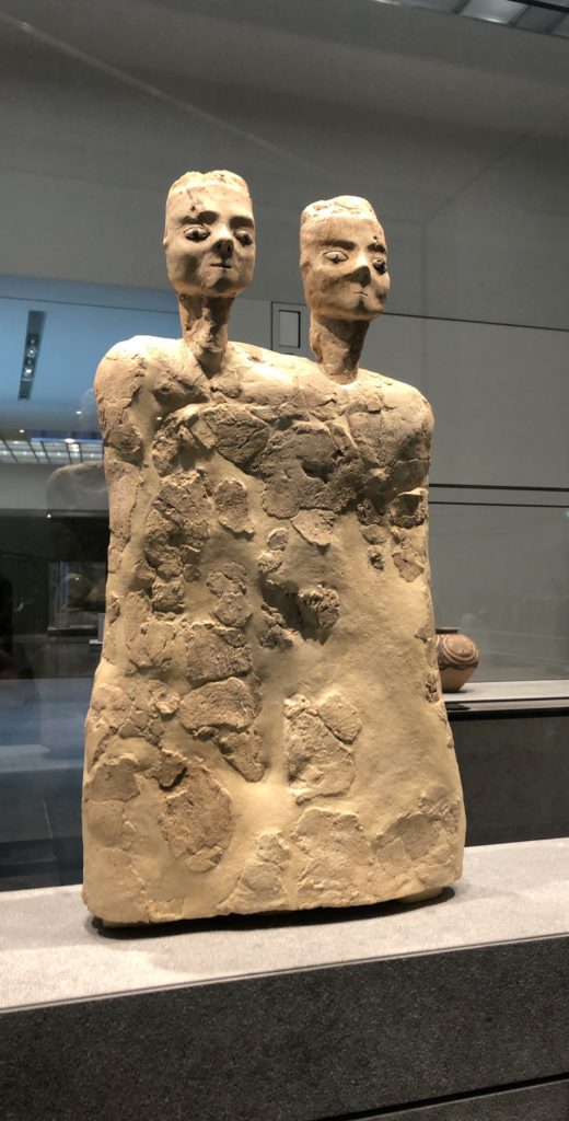 two headed statue at the louvre museum abu dhabi